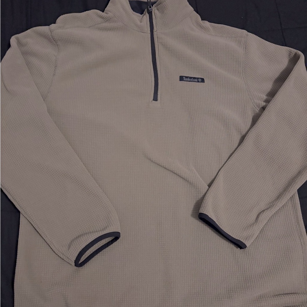 Tan Timberland quarter zip sweatshirt with black accents